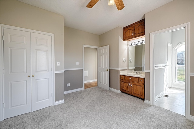 bathroom with vanity and ceiling fan