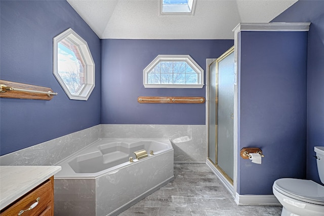 full bathroom with vaulted ceiling with skylight, independent shower and bath, a textured ceiling, and toilet