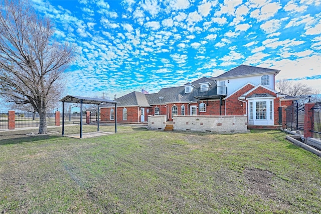 back of property with a pergola and a lawn