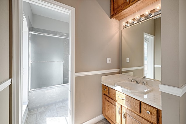 bathroom with vanity and an enclosed shower