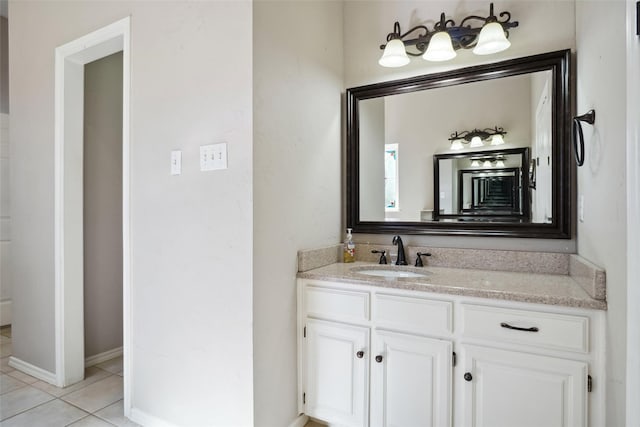 bathroom featuring tile patterned flooring and vanity