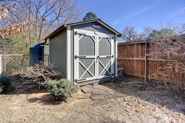 view of shed with fence