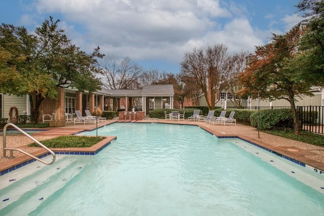 view of swimming pool with a patio