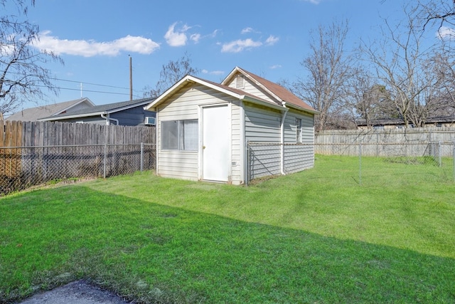 view of outbuilding featuring a lawn