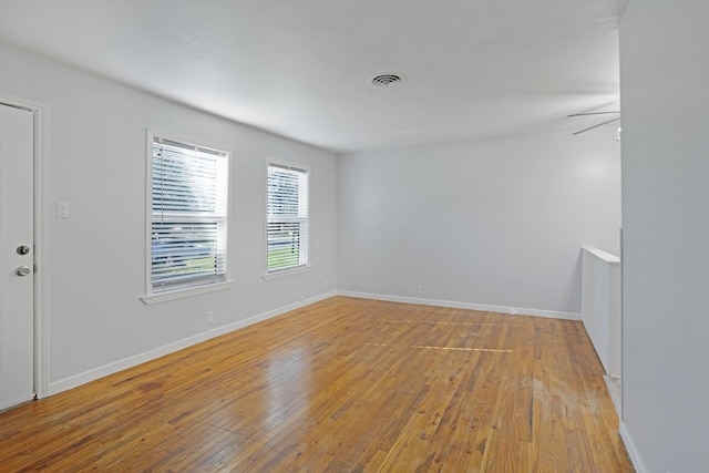 unfurnished room featuring light hardwood / wood-style floors