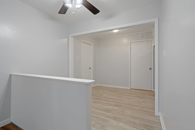 empty room featuring light hardwood / wood-style flooring and ceiling fan