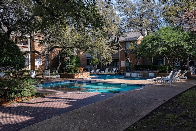 view of swimming pool with a patio area