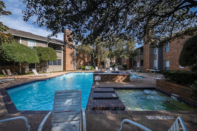 view of swimming pool featuring a patio