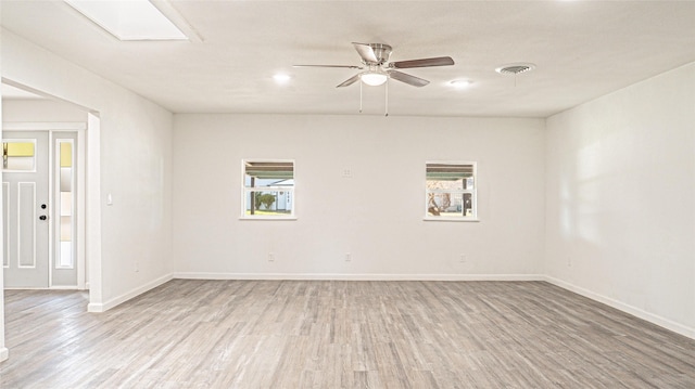 spare room with ceiling fan and light hardwood / wood-style flooring