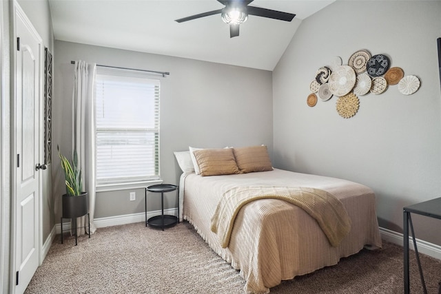 carpeted bedroom with vaulted ceiling and ceiling fan