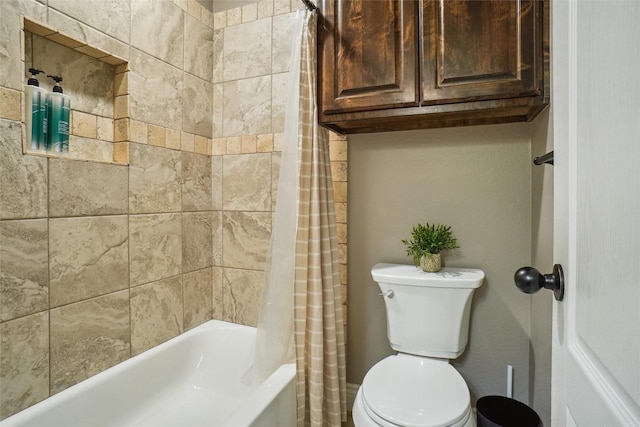 bathroom with toilet and shower / tub combo