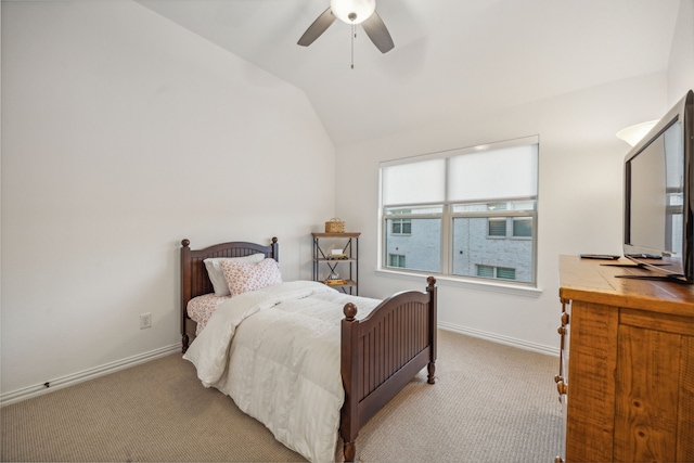 carpeted bedroom with lofted ceiling, ceiling fan, and baseboards