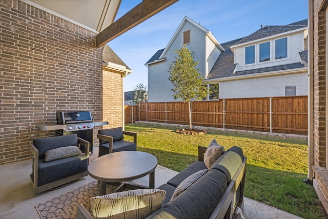 view of patio / terrace featuring an outdoor hangout area, grilling area, and a fenced backyard