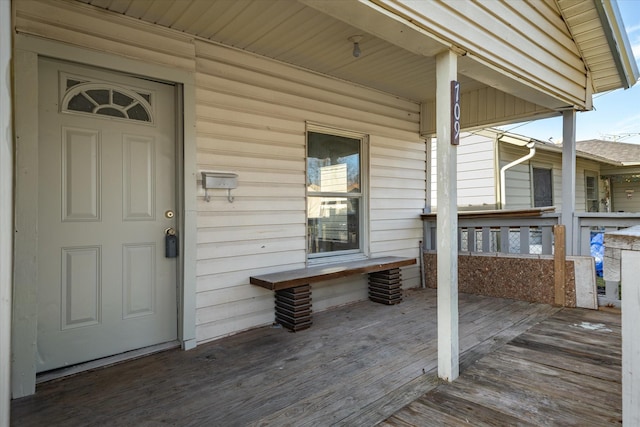 wooden terrace featuring covered porch