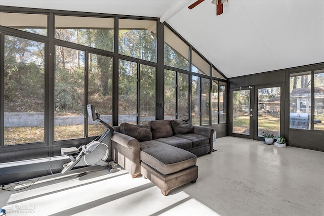 sunroom with a wealth of natural light, ceiling fan, and lofted ceiling with beams