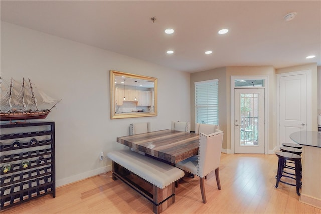 dining space featuring light hardwood / wood-style floors