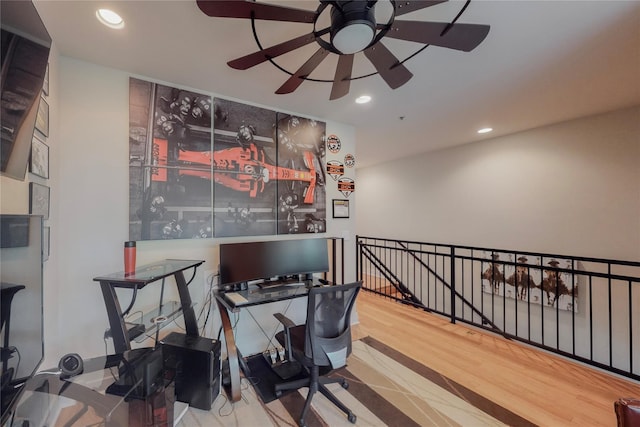 office with hardwood / wood-style flooring and ceiling fan