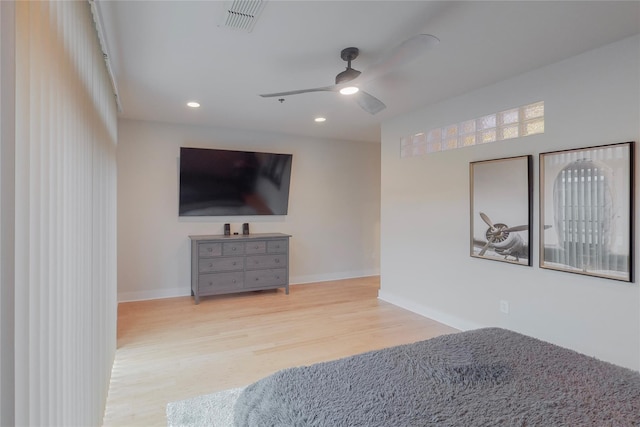 bedroom with ceiling fan and light wood-type flooring