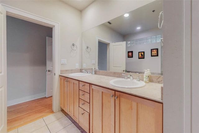 bathroom featuring tile patterned flooring and vanity