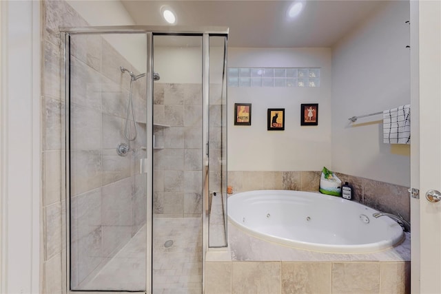 bathroom with shower with separate bathtub