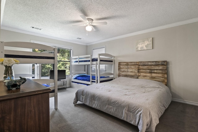 carpeted bedroom with a textured ceiling, ceiling fan, and ornamental molding