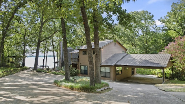 view of front of home with a water view