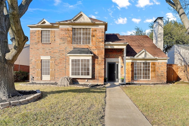 view of front facade with a front lawn