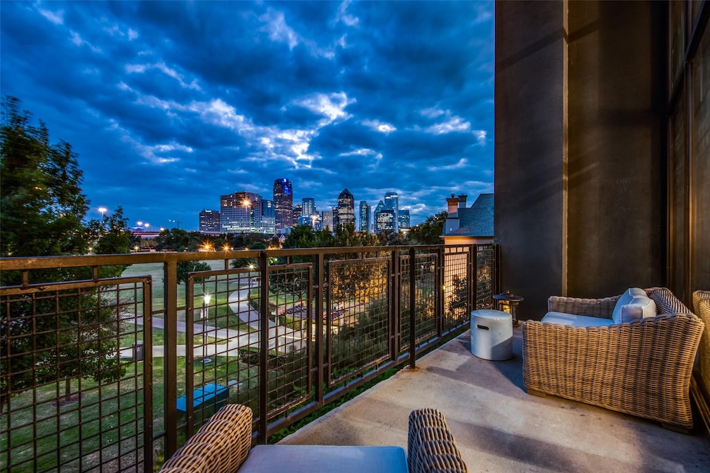 view of balcony at dusk