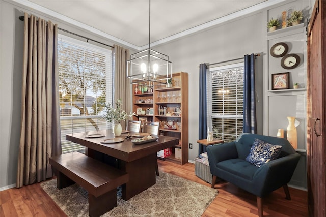 dining room with a chandelier and hardwood / wood-style floors