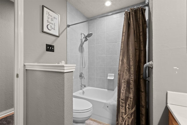 full bathroom featuring vanity, shower / bath combo, toilet, and a textured ceiling