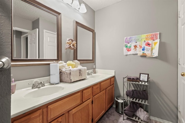 bathroom featuring vanity and a textured ceiling