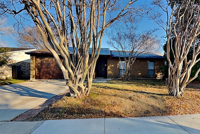 ranch-style house featuring a garage