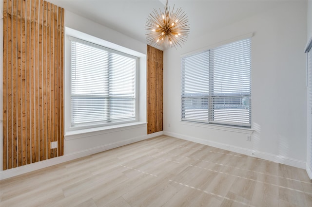 empty room featuring an inviting chandelier