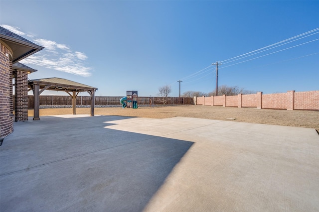 view of patio / terrace with a gazebo and a playground