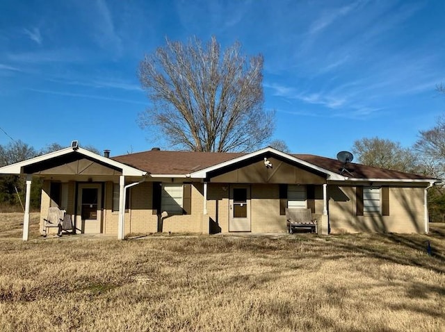 ranch-style house with a front lawn