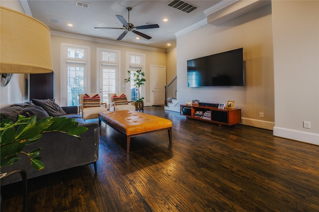 living room featuring ceiling fan, dark wood-type flooring, and ornamental molding