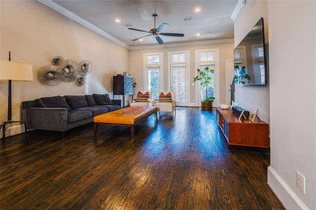 living room featuring ceiling fan, dark hardwood / wood-style floors, and ornamental molding