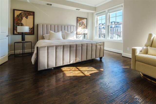 bedroom featuring dark hardwood / wood-style flooring and crown molding