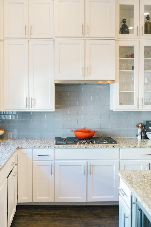 kitchen with white cabinetry, stainless steel gas cooktop, and tasteful backsplash