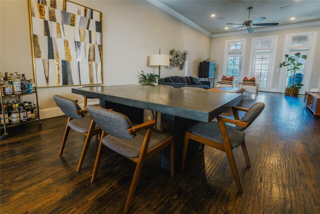 dining room featuring ceiling fan, crown molding, and dark hardwood / wood-style floors