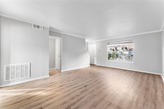 unfurnished living room featuring light hardwood / wood-style flooring and ornamental molding