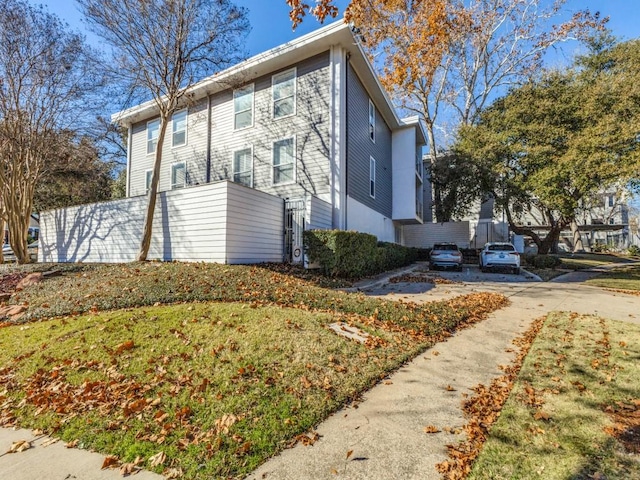 view of property exterior featuring a yard