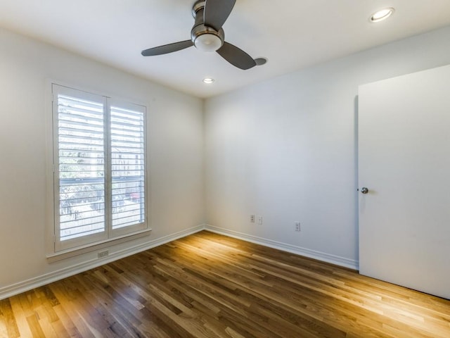 unfurnished room featuring hardwood / wood-style flooring and ceiling fan