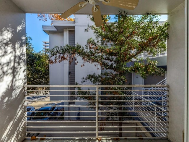 exterior space featuring ceiling fan