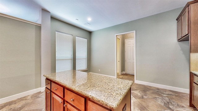 kitchen featuring light stone countertops