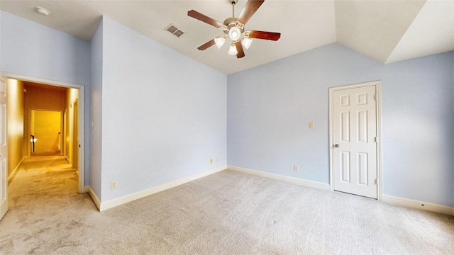 spare room with light colored carpet, ceiling fan, and lofted ceiling