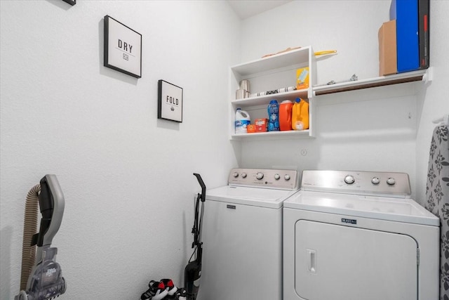 laundry area featuring washing machine and clothes dryer