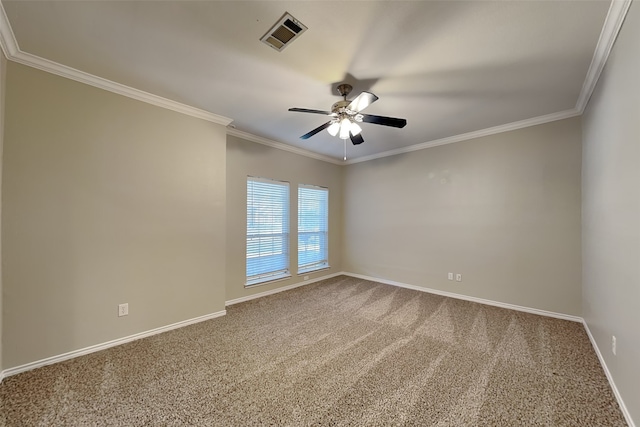 carpeted empty room with ceiling fan and ornamental molding