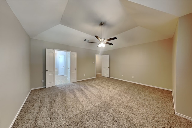 unfurnished bedroom with ceiling fan, light colored carpet, and lofted ceiling