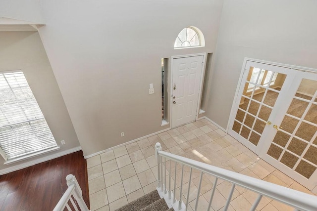 5400 Belle Chasse Ln, Frisco, TX 75035 - tiled entryway with a towering ceiling and baseboards